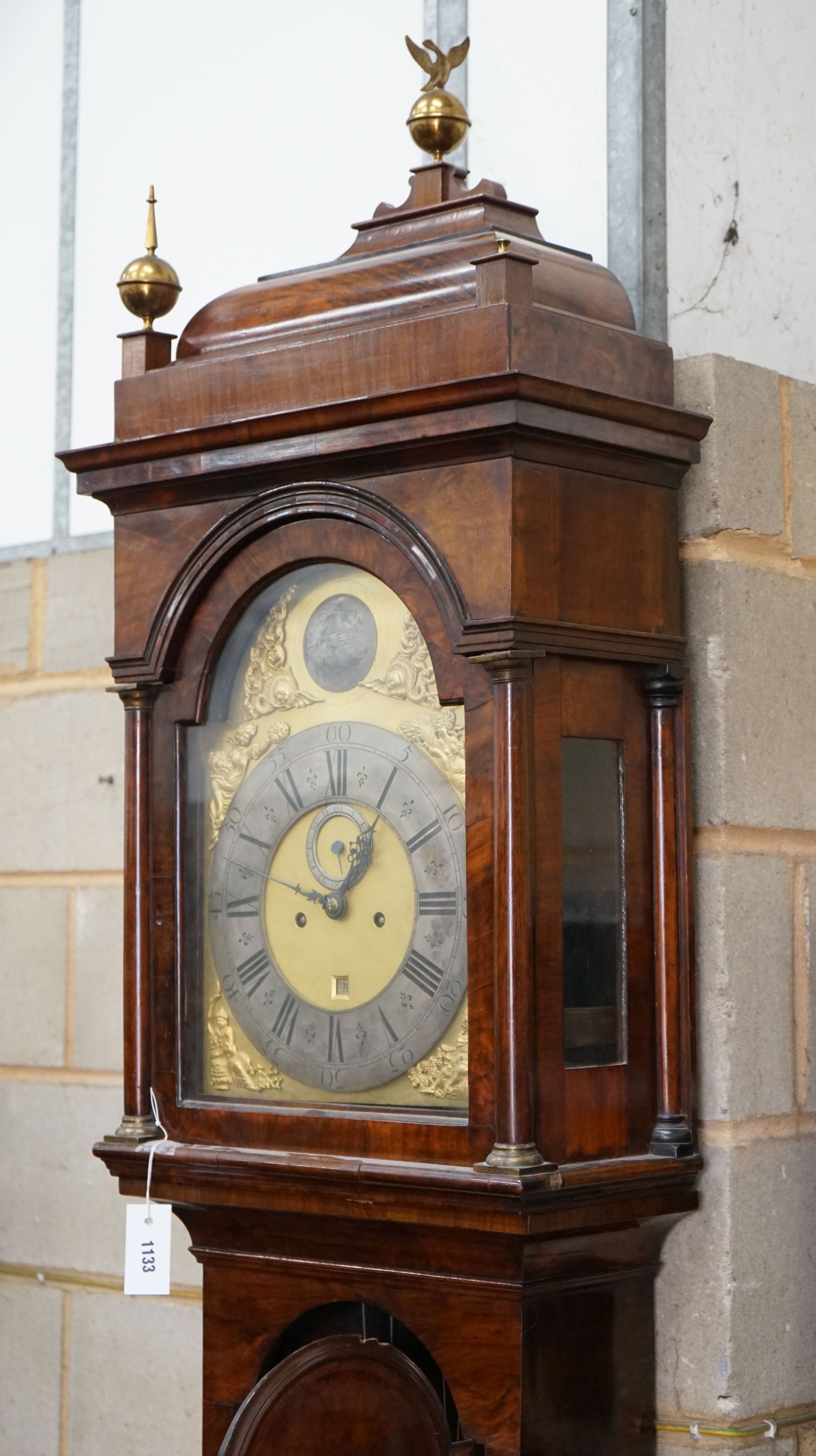 A George III feather banded walnut 8 day longcase clock, height approx. 250cm